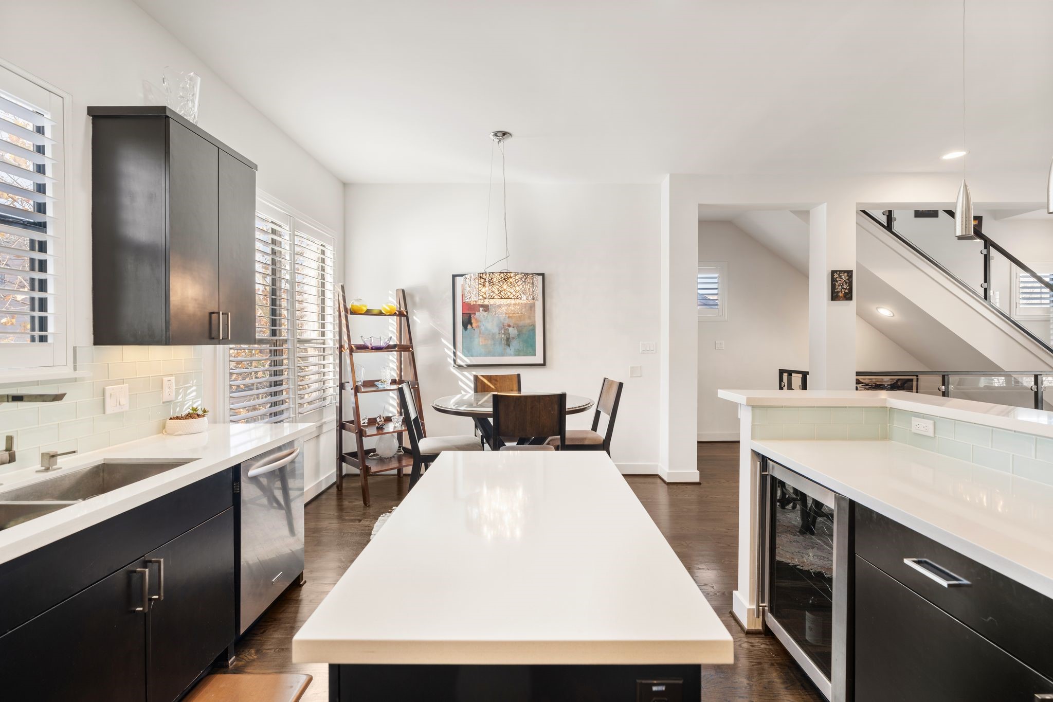 5911 Rose Street Houston, TX 77007 - Photo 13 of 35 Beautifully designed open-concept kitchen featuring a spacious island, premium stainless steel appliances, and a built-in wine or beverage refrigerator.