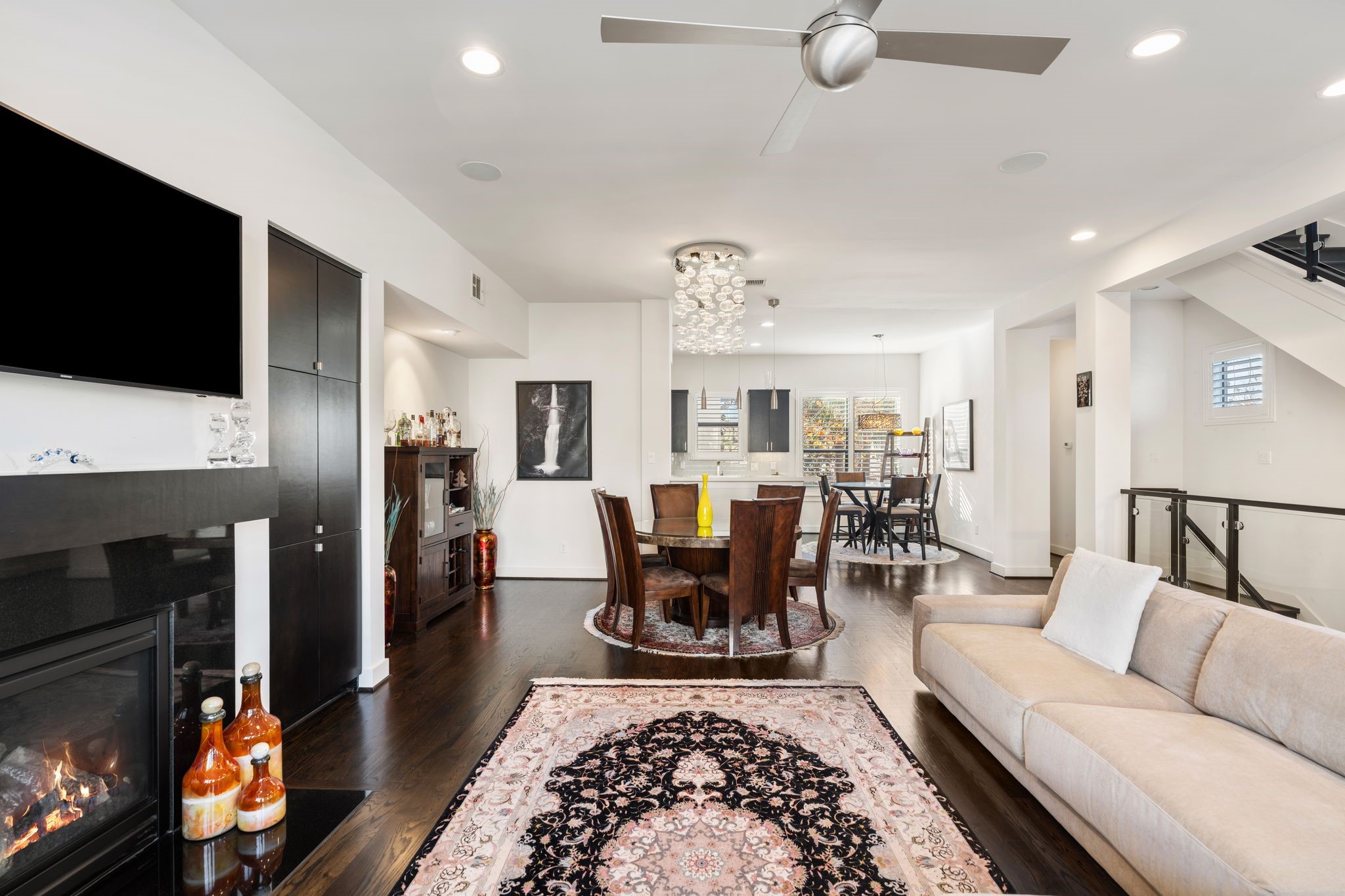 5911 Rose Street Houston, TX 77007 - Photo 34 of 35 Well-designed floor plan featuring a stylish fireplace, custom cabinetry, and a perfectly positioned wall ready for your TV. Thoughtful lighting throughout enhances the space, creating a warm and inviting atmosphere.