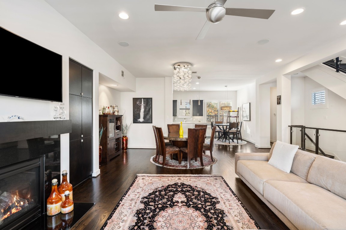 5911 Rose Street Houston, TX 77007 - Photo 37 of 40 Well-designed floor plan featuring a stylish fireplace, custom cabinetry, and a perfectly positioned wall ready for your TV. Thoughtful lighting throughout enhances the space, creating a warm and inviting atmosphere.