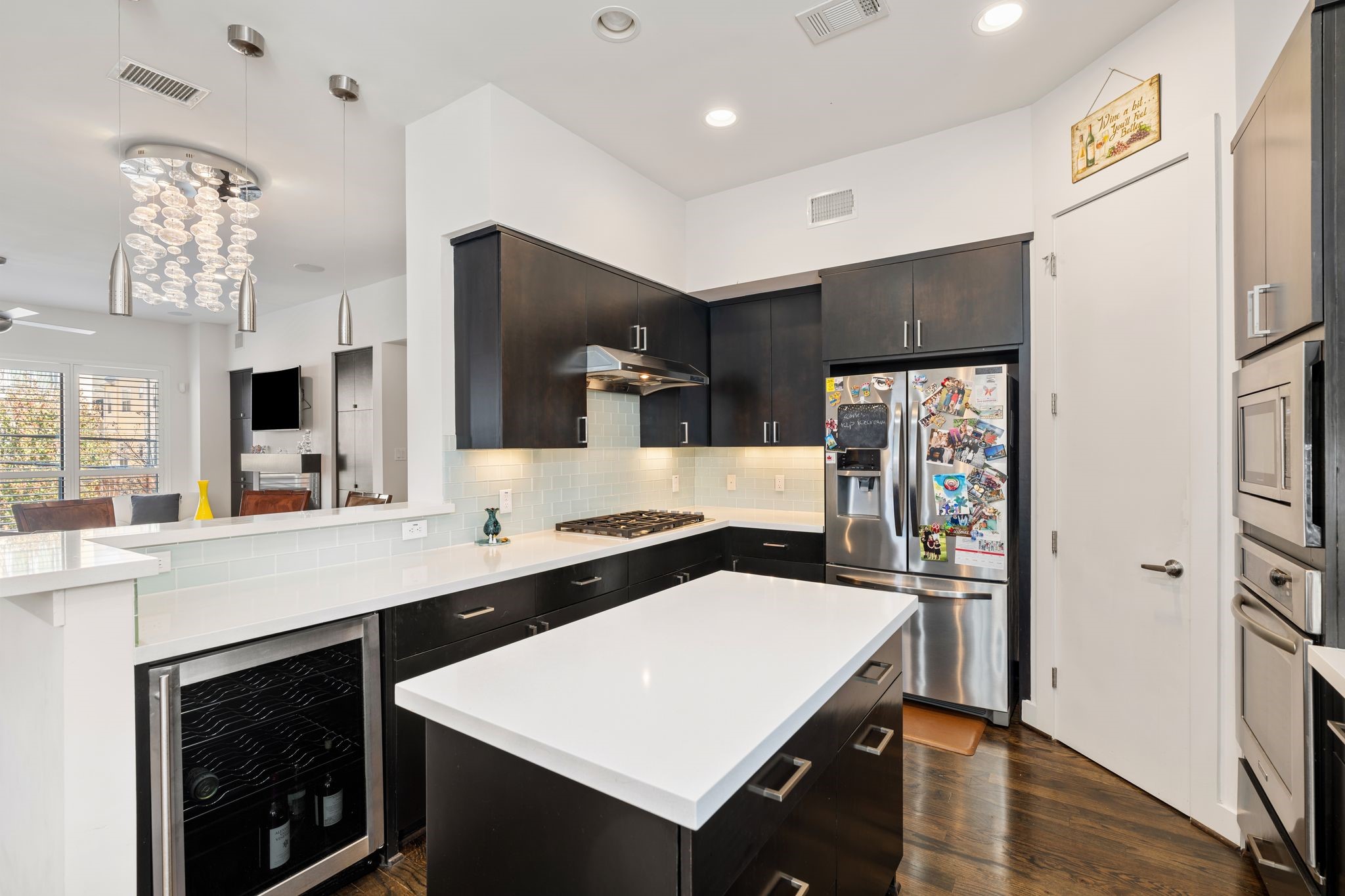 5911 Rose Street Houston, TX 77007 - Photo 7 of 35 Chef-inspired kitchen featuring a large island, gas range, abundant cabinetry, and open sightlines to the main living areas.