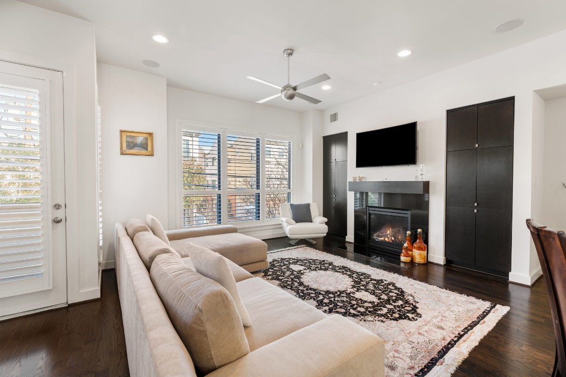 5911 Rose Street Houston, TX 77007 - Photo 8 of 40 Expansive open-concept living space with engineered wood floors, high ceilings, and oversized windows—perfect for everyday living and entertaining.