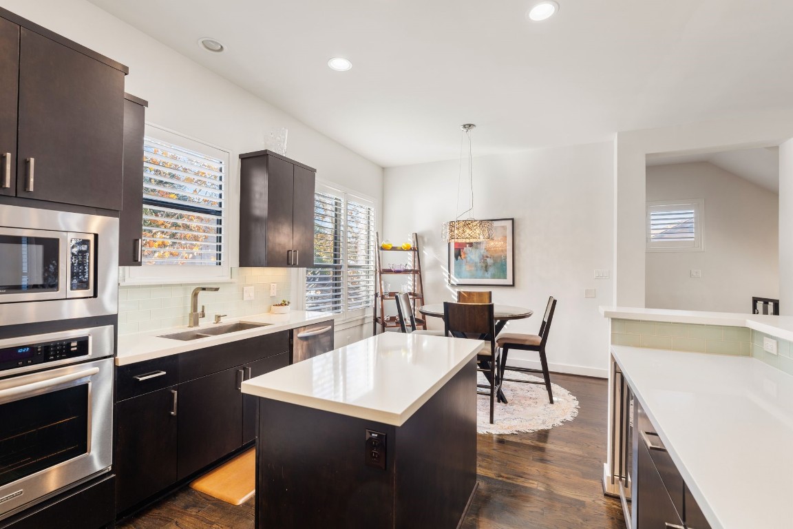 5911 Rose Street Houston, TX 77007 - Photo 9 of 40 Modern finishes, ample counter space, and functional layout designed for both cooking and entertaining.