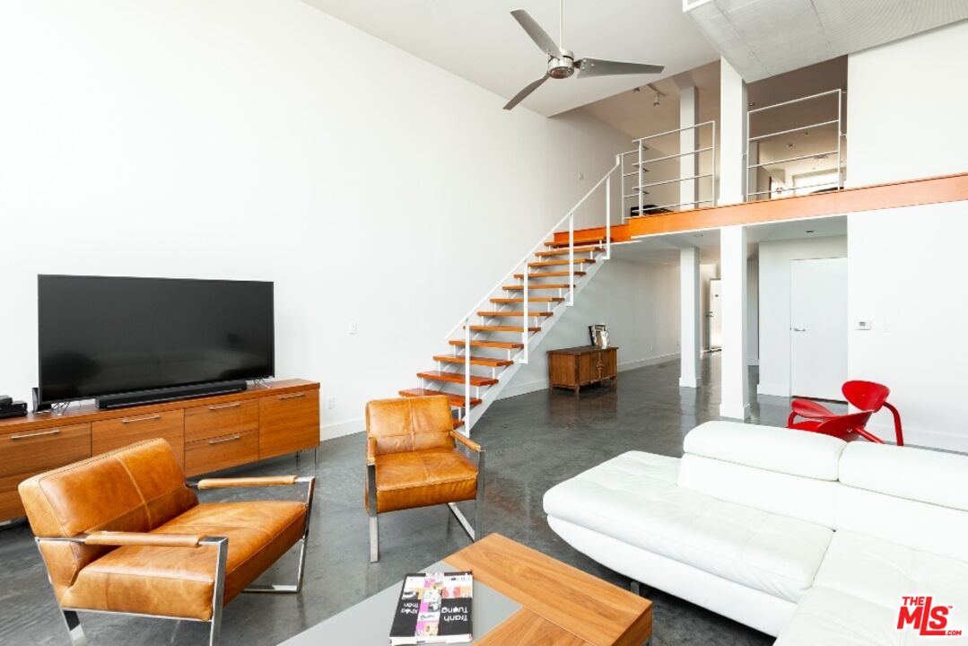 615 Hampton Drive, Unit A109 Venice, CA 90291 - Photo 4 of 12 a living room with furniture and a flat screen tv