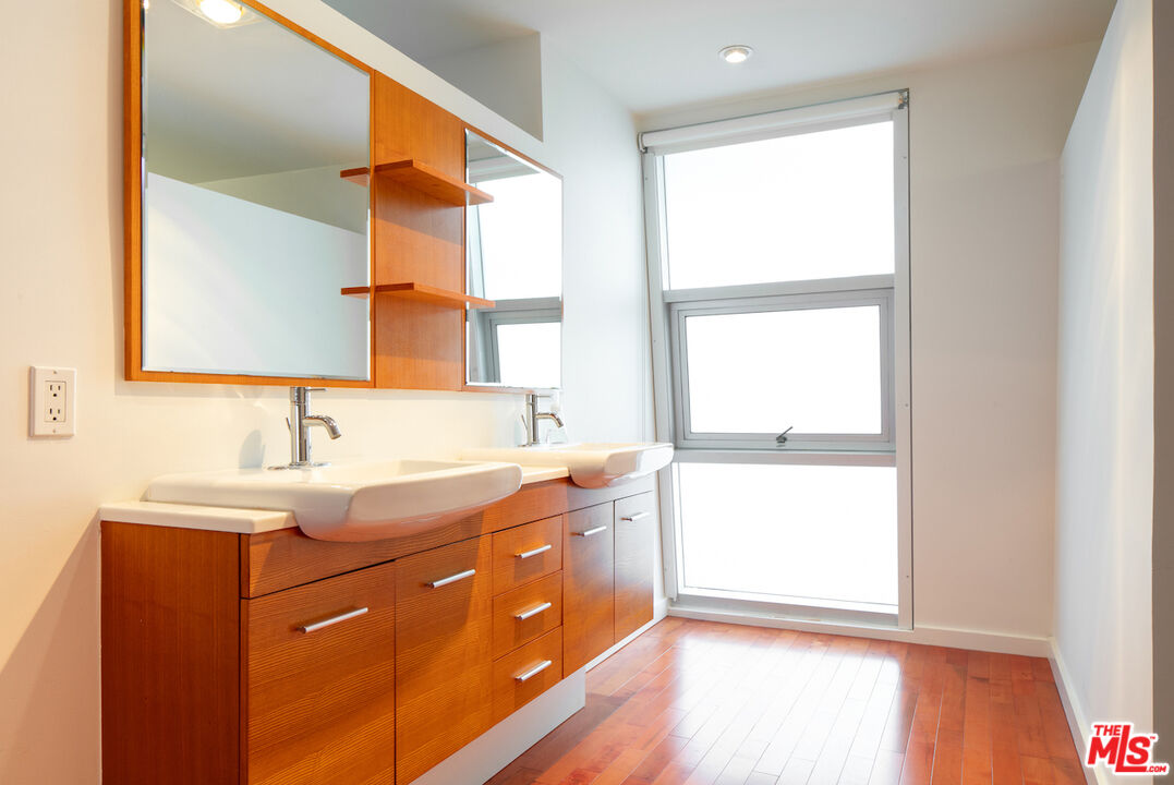 615 Hampton Drive, Unit A109 Venice, CA 90291 - Photo 10 of 12 a bathroom with a sink and a window