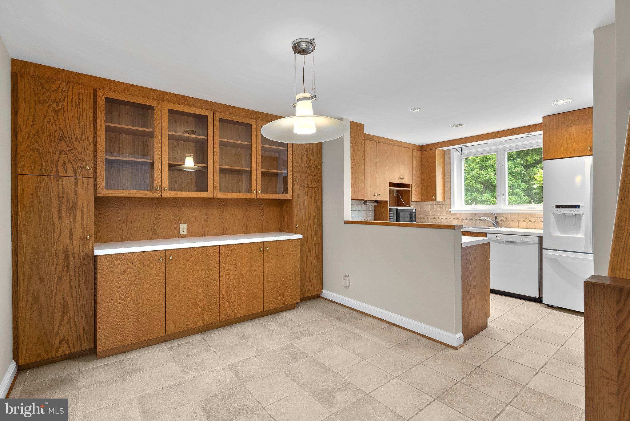 17 Ridge Road Greenbelt, MD 20770 - Photo 9 of 35 Dining Room w/Built-in Glass Front Cabinetry