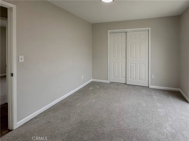 a view of an empty room and entryway