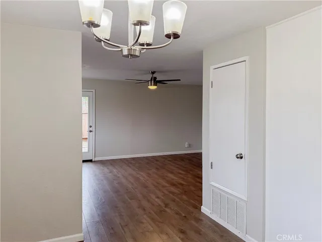 an empty room with wooden floor