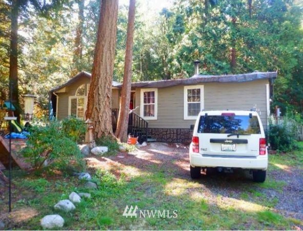 261 Baher Road Point Roberts, WA 98281 - Photo 1 of 3 a view of house with backyard space and garden