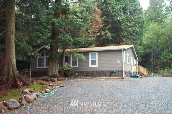 261 Baher Road Point Roberts, WA 98281 - Photo 2 of 3 a view of a house with backyard and sitting area