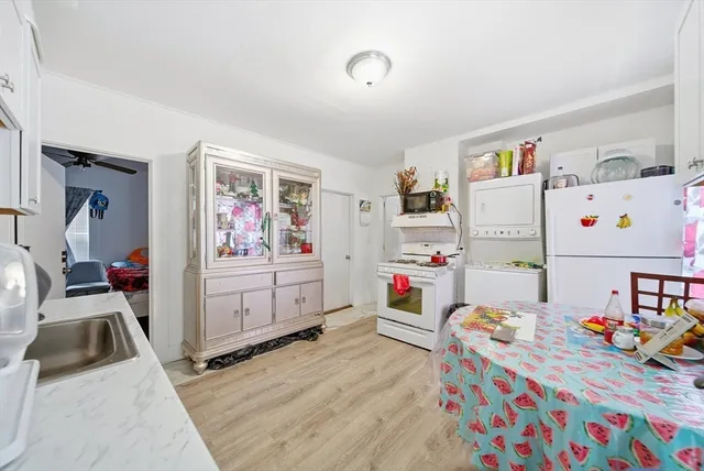 a room that has a bed and a dresser in it