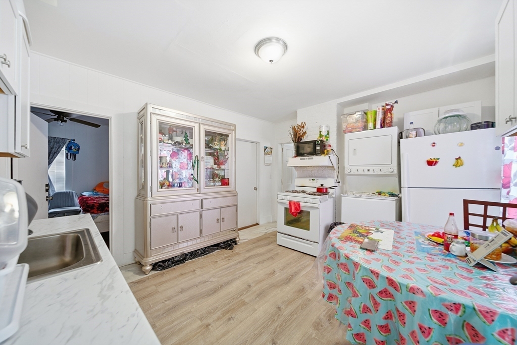 94 Sheridan Street Lynn, MA 01902 - Photo 11 of 33 a room that has a bed and a dresser in it