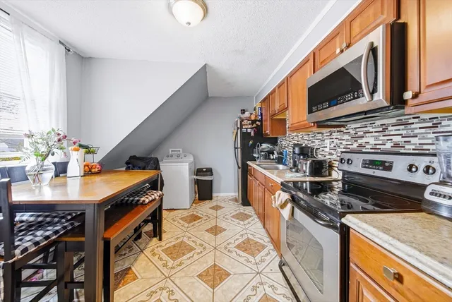 a kitchen that has a sink and a stove