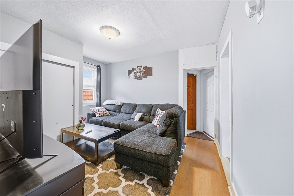 94 Sheridan Street Lynn, MA 01902 - Photo 20 of 33 a living room with furniture and a window