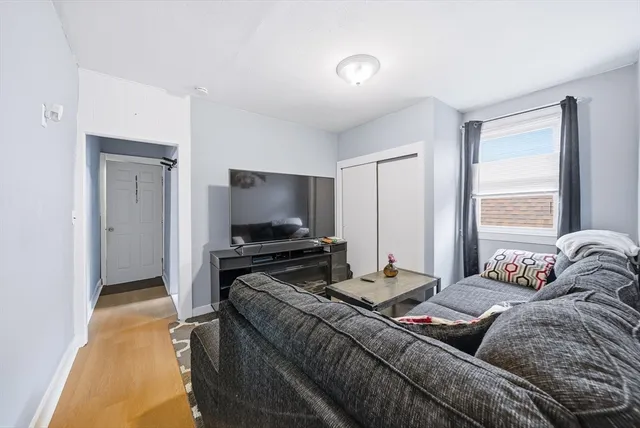 a bedroom with a bed and a television