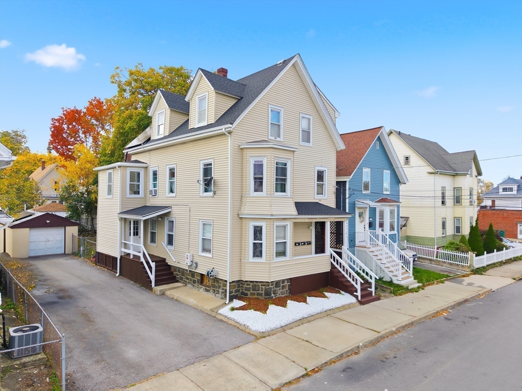 94 Sheridan Street Lynn, MA 01902 - Photo 28 of 33 a view of a big house with wooden fence