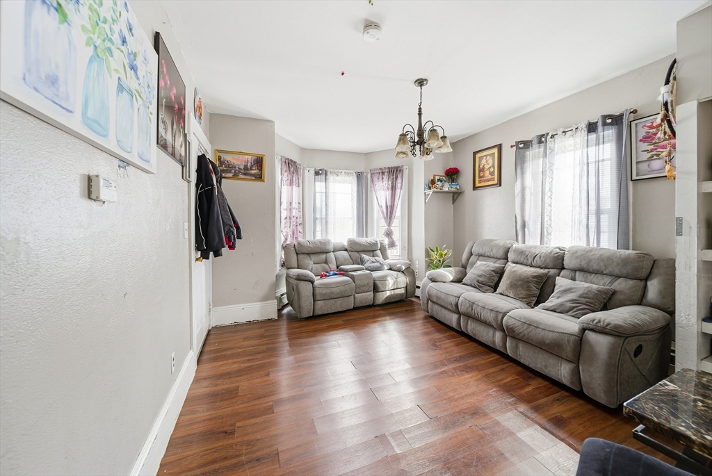 94 Sheridan Street Lynn, MA 01902 - Photo 3 of 33 a living room with furniture and a wooden floor