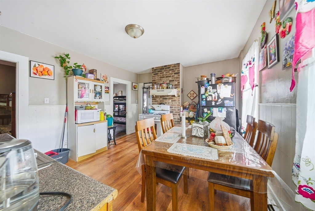 94 Sheridan Street Lynn, MA 01902 - Photo 6 of 33 a view of a dining room with furniture and wooden floor