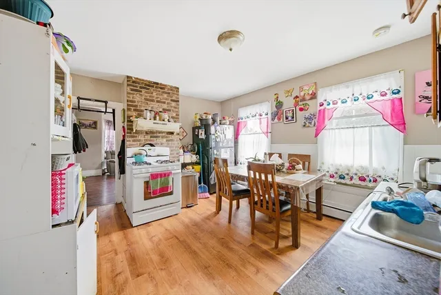 a living room with lots of furniture and a wooden floor