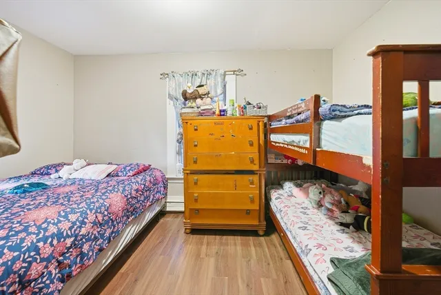 a bed room with a bed and a dresser