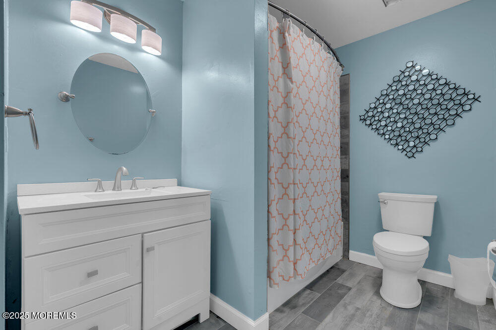 25 Concord Circle Howell, NJ 07731 - Photo 12 of 26 a bathroom with a toilet sink and mirror