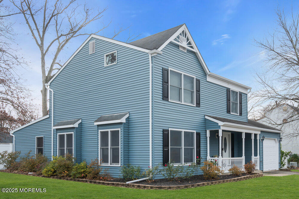 25 Concord Circle Howell, NJ 07731 - Photo 2 of 26 a front view of a house with a yard and garage