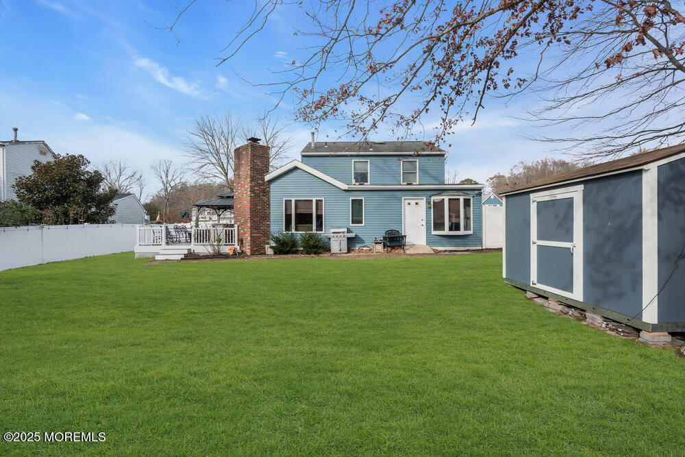 25 Concord Circle Howell, NJ 07731 - Photo 21 of 26 a front view of a house with a yard