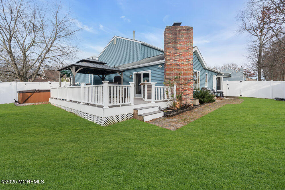 25 Concord Circle Howell, NJ 07731 - Photo 22 of 26 a front view of a house with a garden and deck
