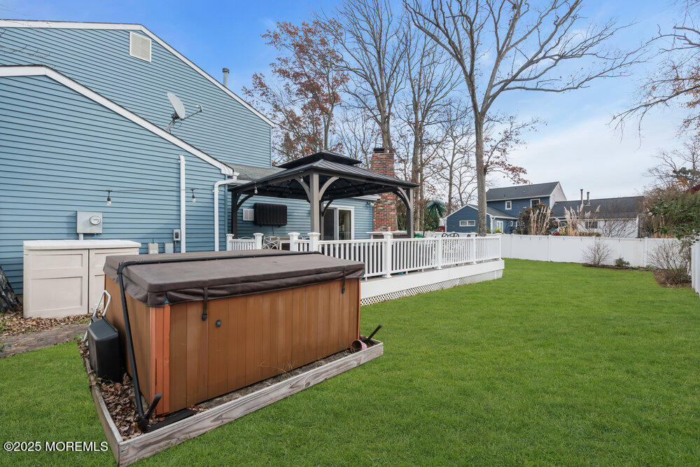 25 Concord Circle Howell, NJ 07731 - Photo 23 of 26 a view of a house with backyard and a garden