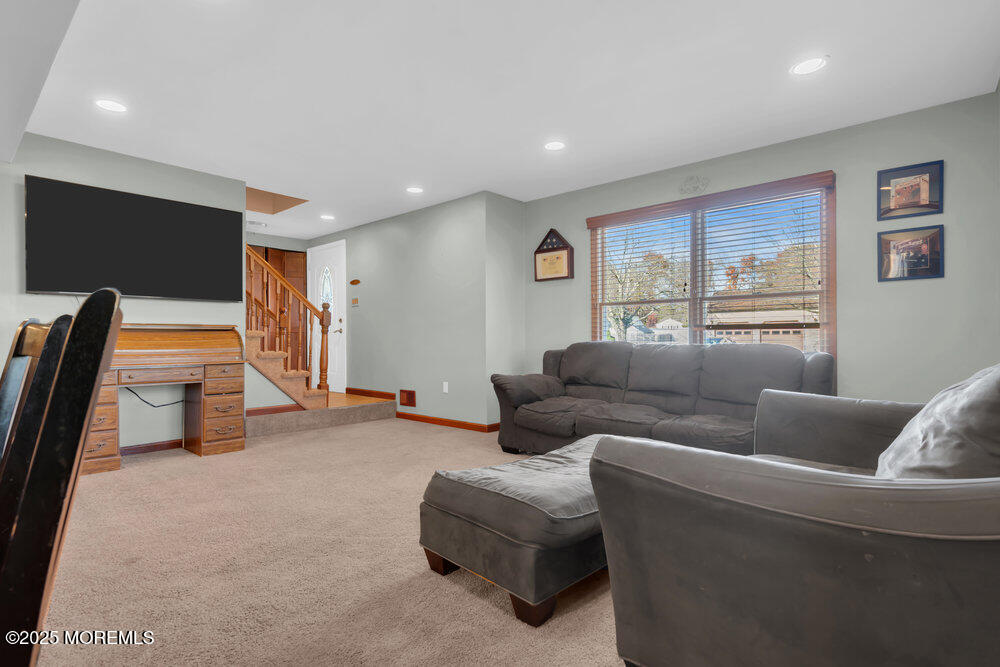 25 Concord Circle Howell, NJ 07731 - Photo 5 of 26 a living room with furniture and a flat screen tv