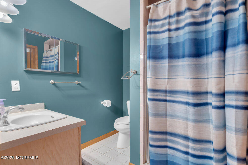 25 Concord Circle Howell, NJ 07731 - Photo 9 of 26 a bathroom with a sink toilet and shower