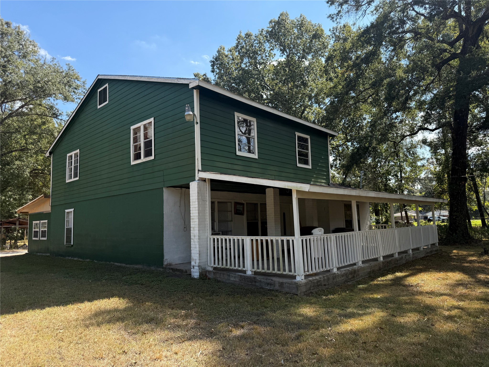 20785 Deuster Lane Porter, TX 77365 - Photo 2 of 28 a view of a house with a small yard and wooden fence