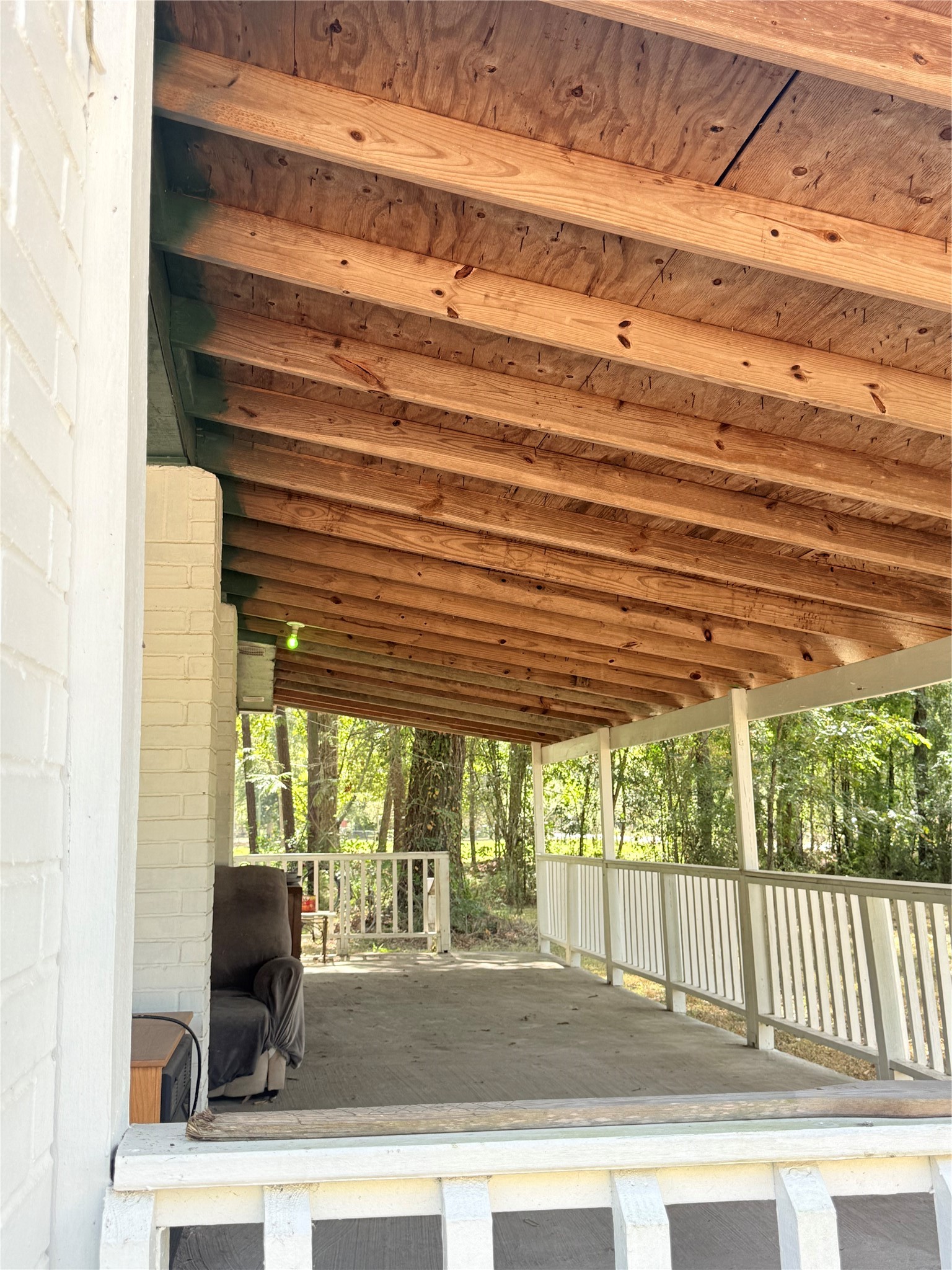 20785 Deuster Lane Porter, TX 77365 - Photo 6 of 28 a view of a porch with wooden floor