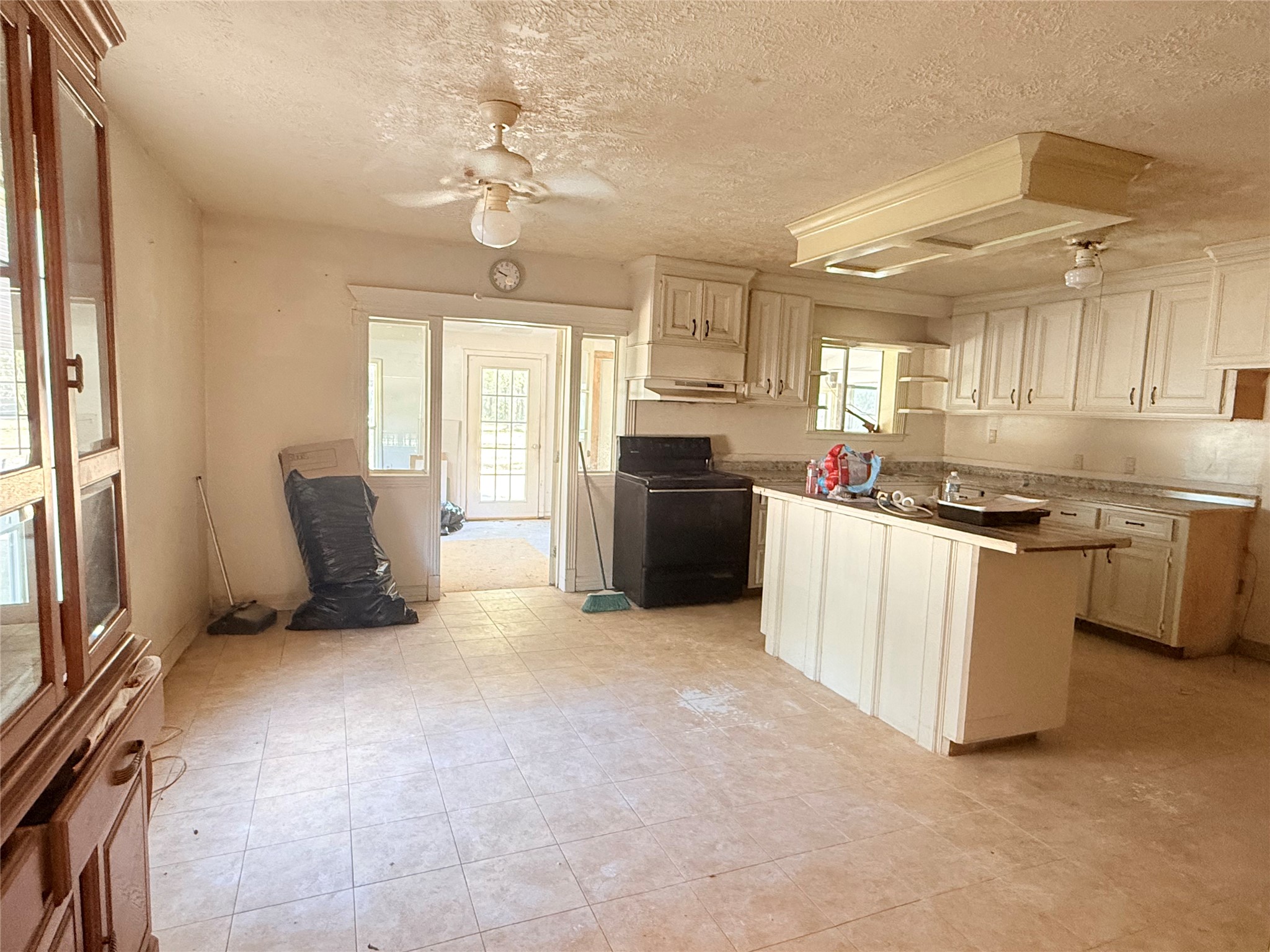 20785 Deuster Lane Porter, TX 77365 - Photo 10 of 28 a kitchen with stainless steel appliances granite countertop a stove a sink dishwasher a refrigerator and white cabinets with wooden floor