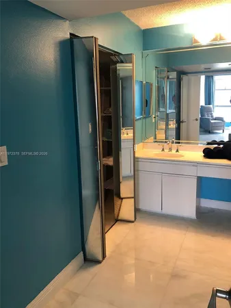 a room with pool table and flat screen tv