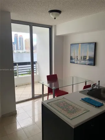a dining room with a table and chairs