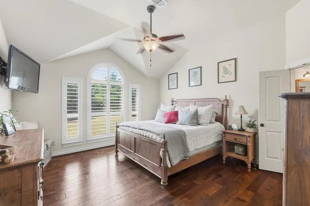 a spacious bathroom with a granite countertop sink and a mirror