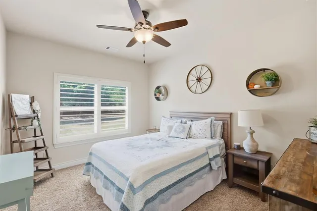 a bathroom with a granite countertop sink and a mirror a bathtub