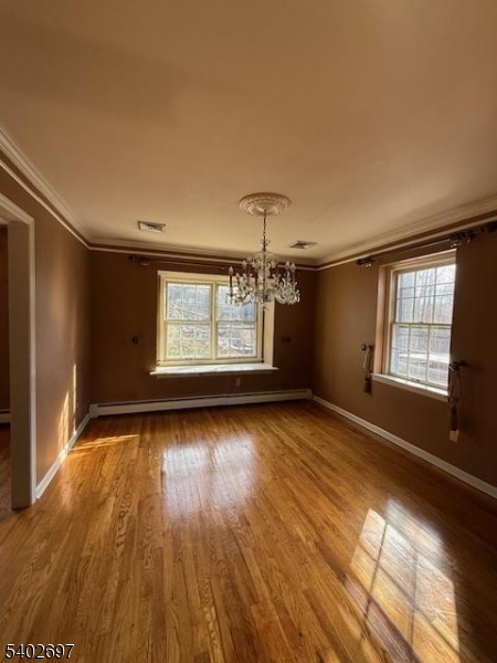 46 Whippoorwill Lane Sparta, NJ 07871 - Photo 5 of 20 wooden floor in an empty room with a window