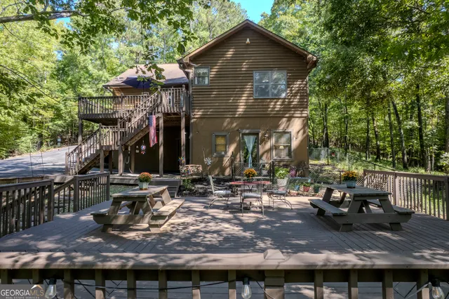 a view of a roof deck with chair and wooden floor