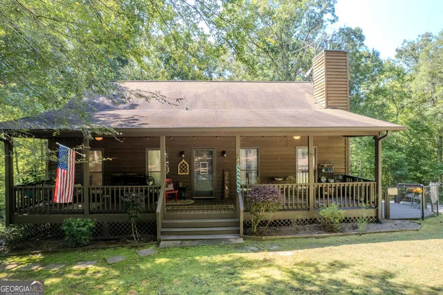 a living room with fireplace furniture and a flat screen tv