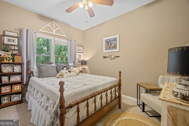 a bed room with a bed and a chandelier