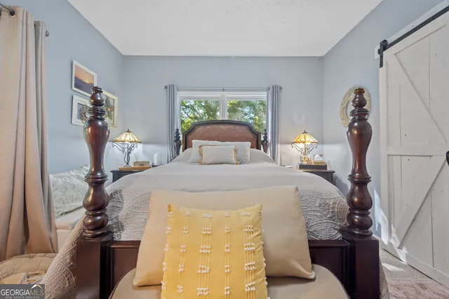 a room with lots of furniture and white walls