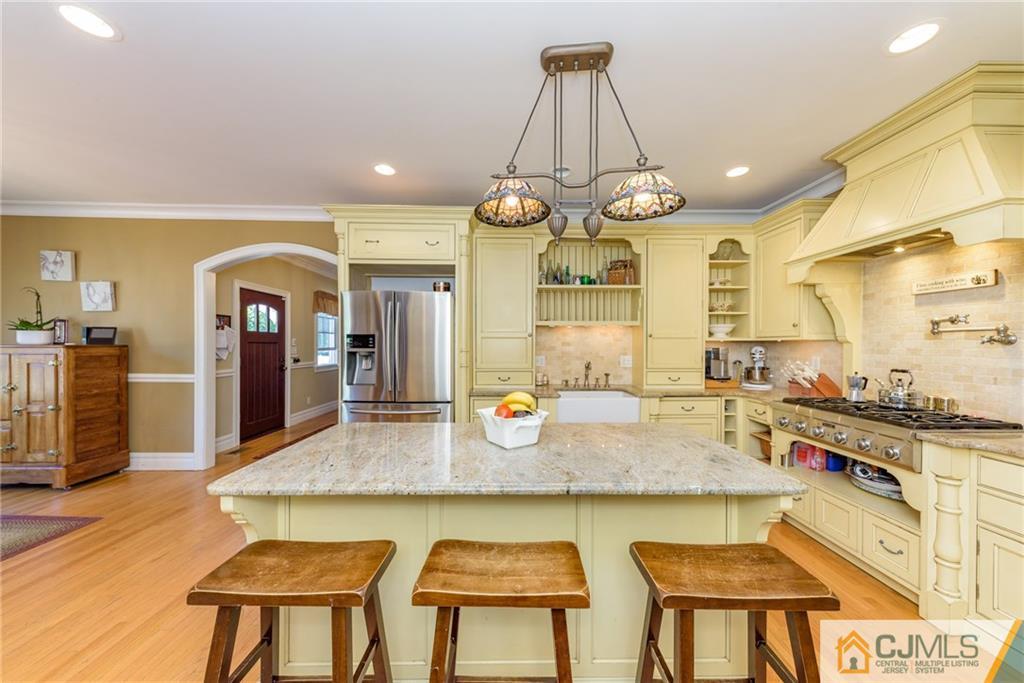 40 Pickle Road Califon, NJ 07830 - Photo 11 of 50 a large kitchen with granite countertop a stove a sink a counter space and dining table