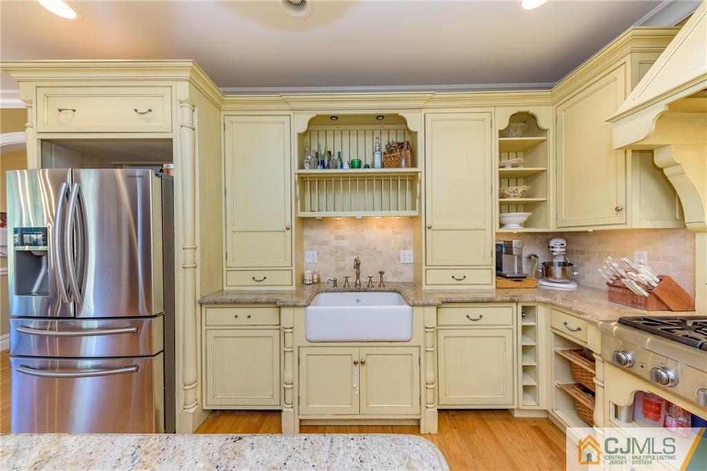 40 Pickle Road Califon, NJ 07830 - Photo 13 of 50 a kitchen with stainless steel appliances a stove a refrigerator and cabinets