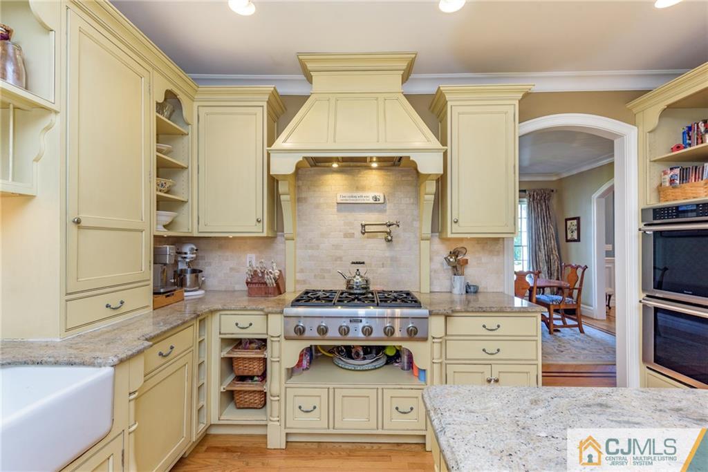 40 Pickle Road Califon, NJ 07830 - Photo 15 of 50 a kitchen with a stove and a white wooden cabinets