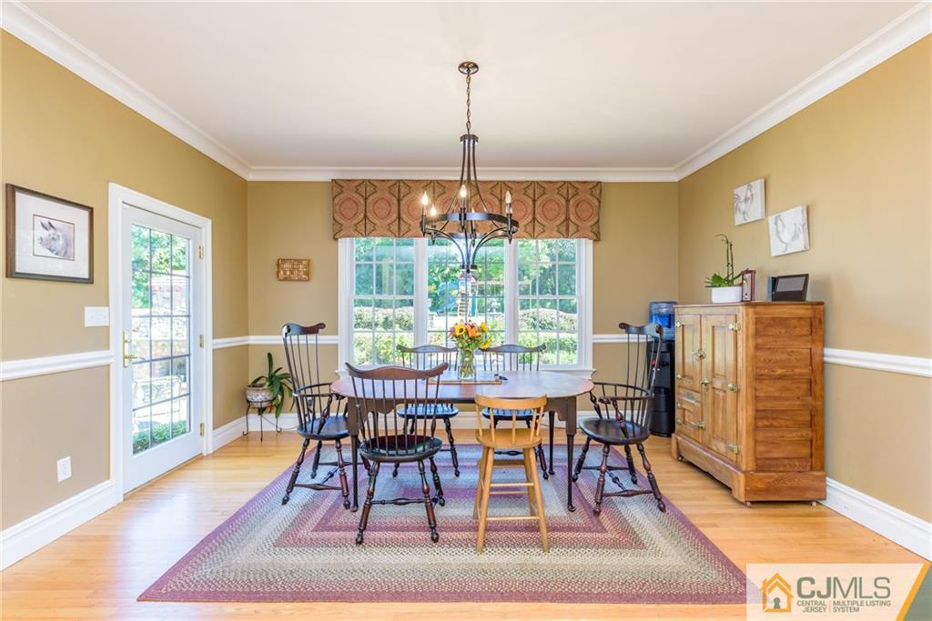 40 Pickle Road Califon, NJ 07830 - Photo 16 of 50 a dining room with furniture a rug and wooden floor