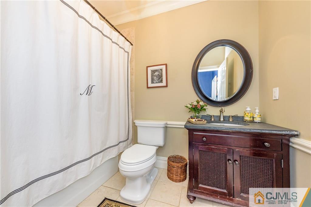 40 Pickle Road Califon, NJ 07830 - Photo 19 of 50 a bathroom with a toilet a sink and a mirror