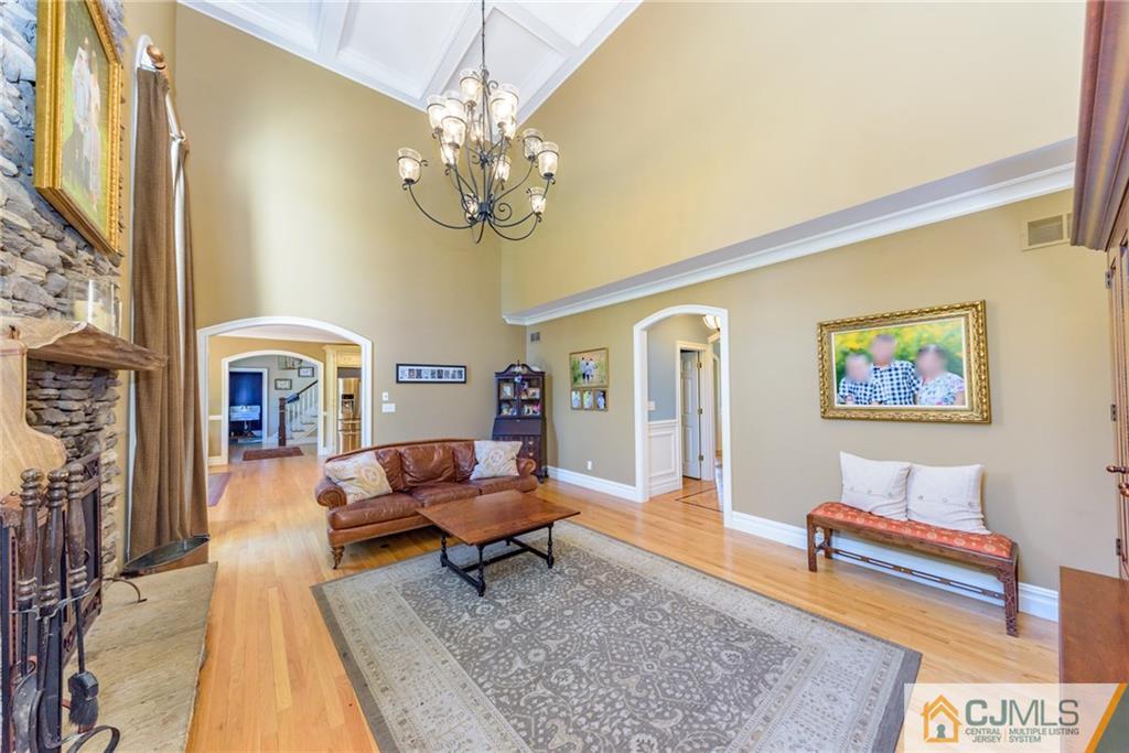40 Pickle Road Califon, NJ 07830 - Photo 21 of 50 a living room with furniture and a chandelier