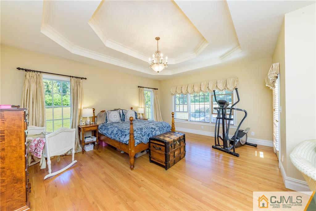 40 Pickle Road Califon, NJ 07830 - Photo 23 of 50 a living room with furniture gym equipment and a large window