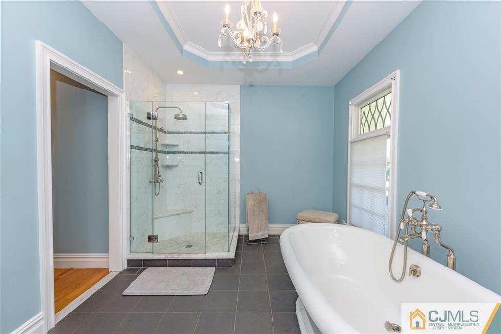 40 Pickle Road Califon, NJ 07830 - Photo 26 of 50 a bathroom with a tub shower and a sink